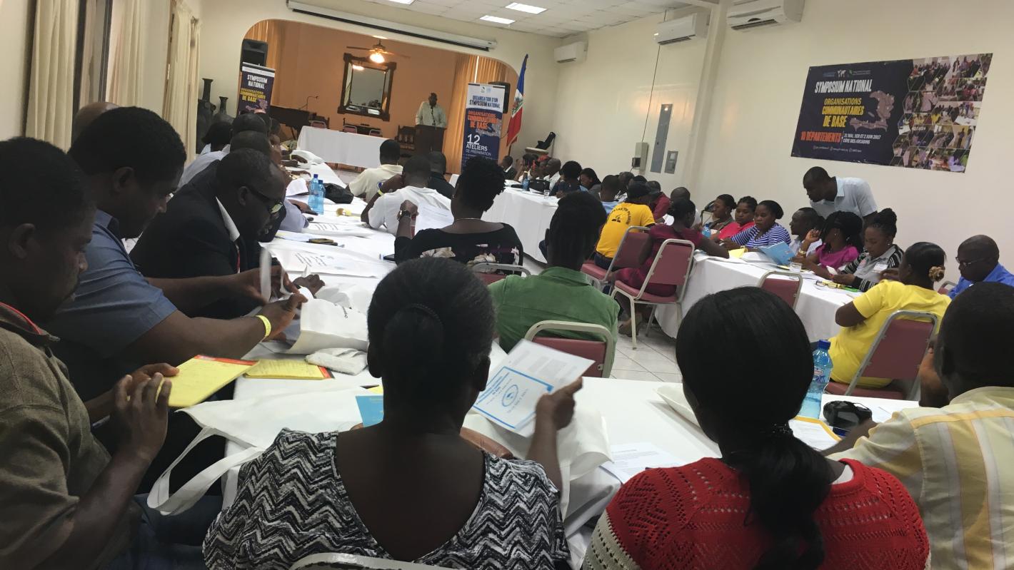 A room of people sitting at desks